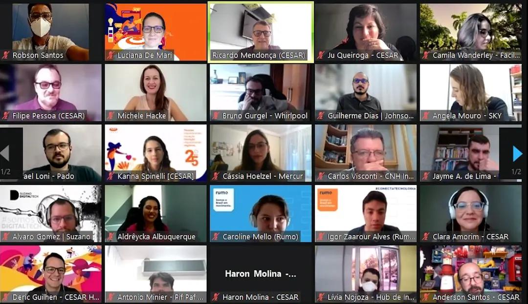 Captura de tela de uma videoconferência em formato de grade exibindo os rostos de dezenas de profissionais e executivos participantes de um workshop online